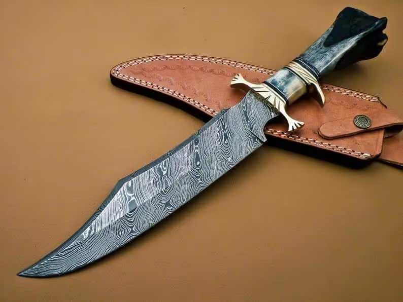 Wilderness Guardian: Bowie Knife with Twist Damascus Steel Blade, Bone Handle, Brass Guards, and Leather Sheath (SC)